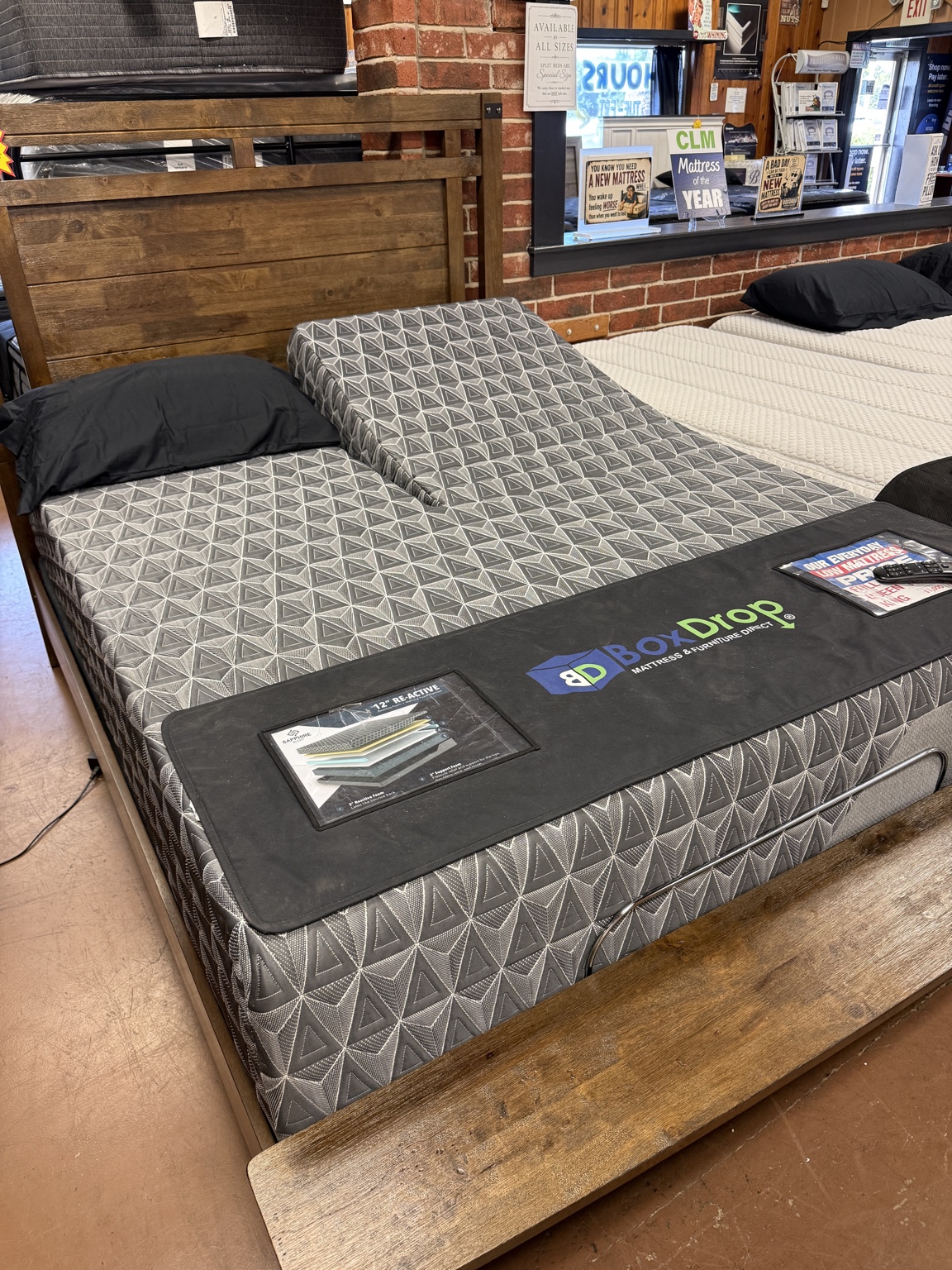Mattress and adjustable base display with BoxDrop branding in our Cuba showroom